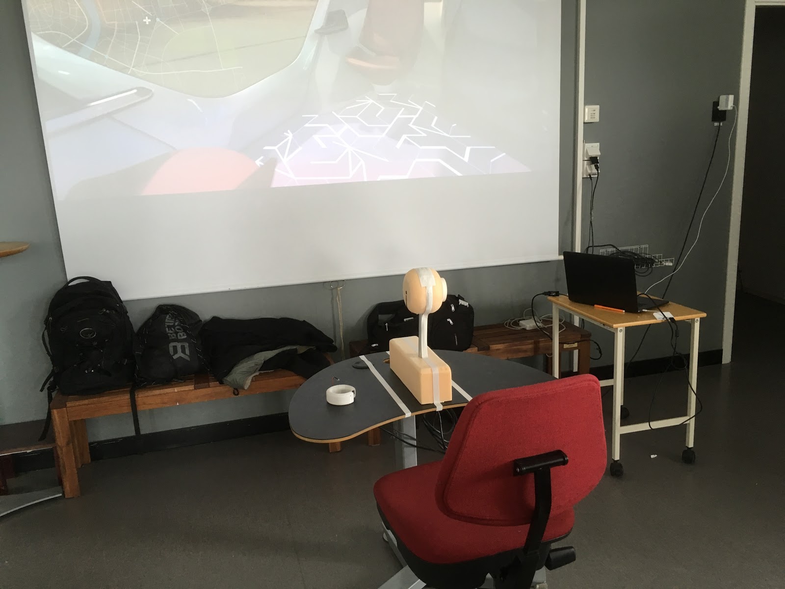 A hi-fi prototype in front of a projector screen.