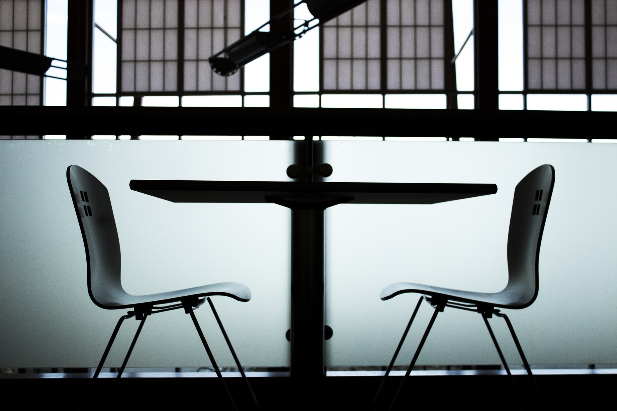 A table and two empty chairs.